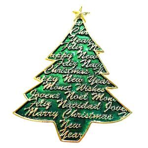 Vintage Monet Christmas tree brooch green enamel on goldtone textured script